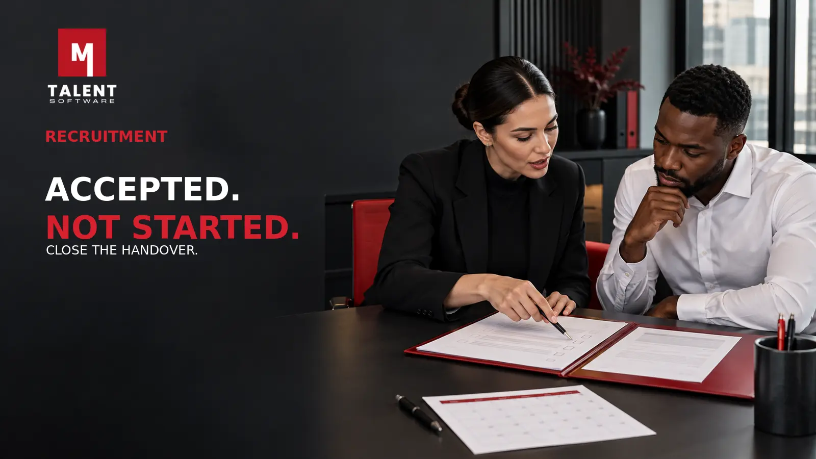 Recruiter and candidate reviewing an accepted offer and start-date checklist