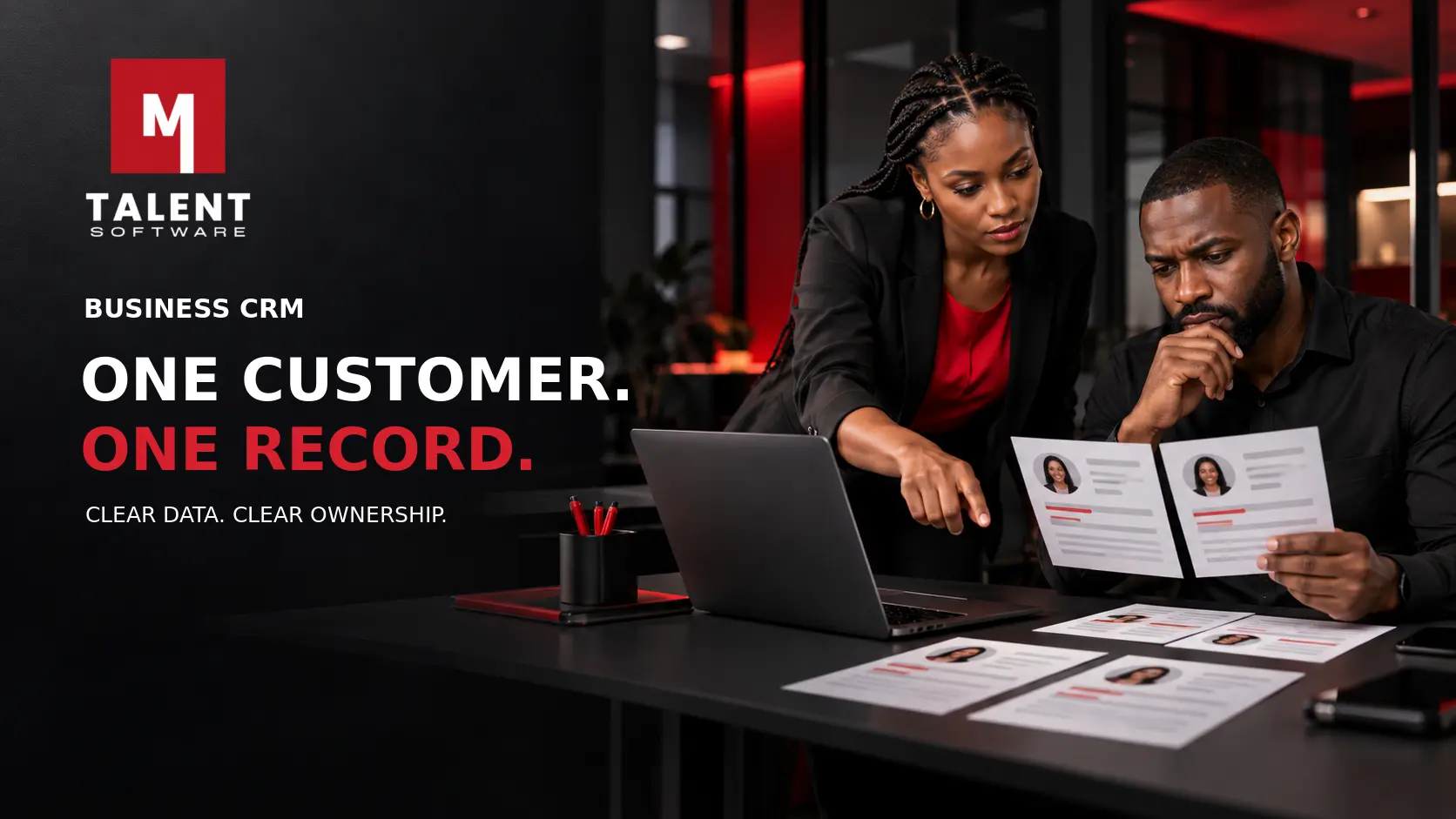 Sales and operations colleagues comparing duplicate customer records in a Business CRM